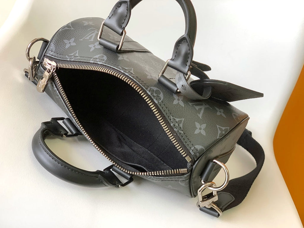 LOUIS VUITTON KEEPALL BANDOULIÈRE 25 IN BLACK MONOGRAM HERITAGE CANVAS