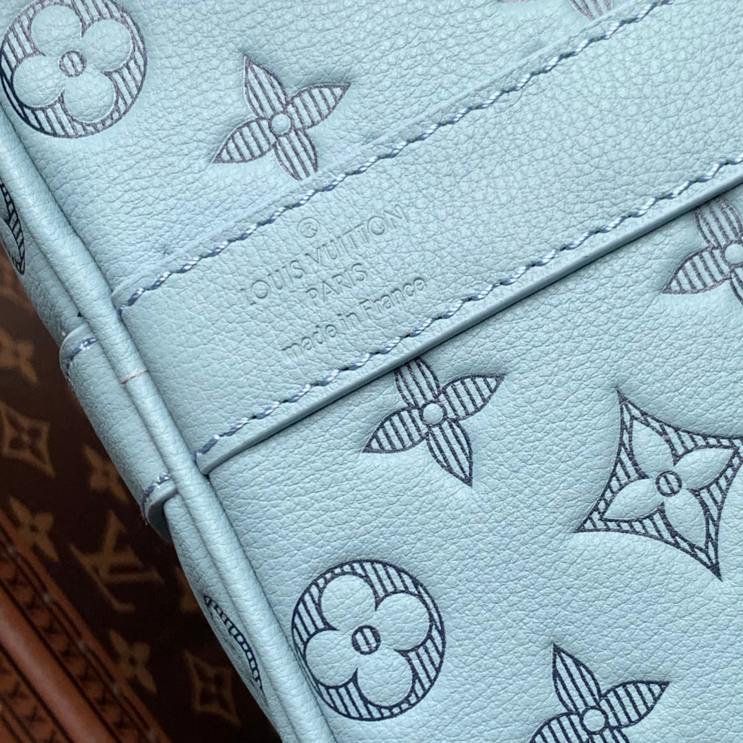 LOUIS VUITTON KEEPALL BANDOULIÈRE 50 IN SKY BLUE MONOGRAM SHADOW EMBOSSED CALFSKIN